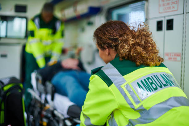 Paramedics with ambulance