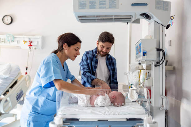 Midwife checking baby
